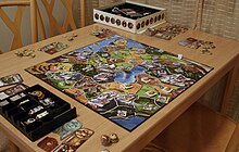 One of the games illustrated by Coimbra: Small World. Small World game being played.jpg