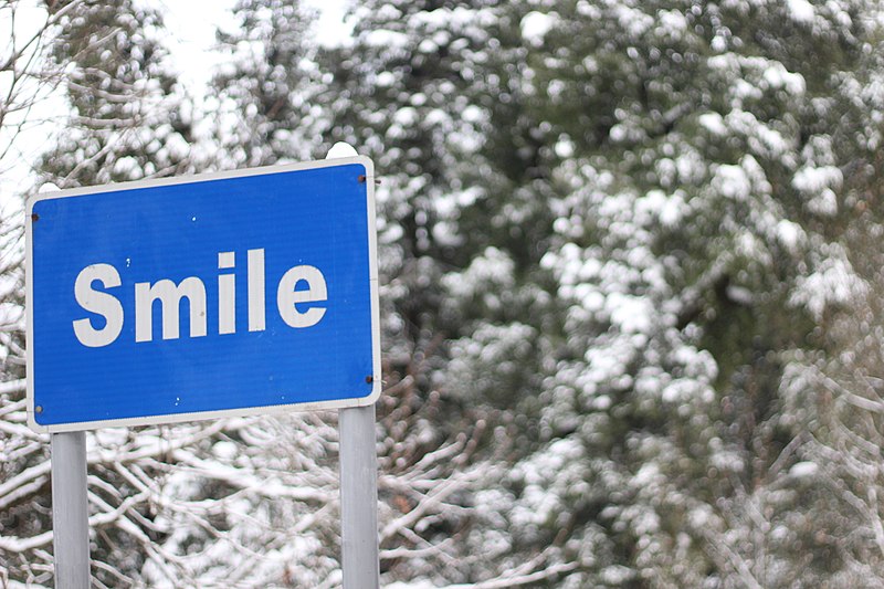 File:Smile on a sign board.jpg