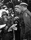 Thumbnail for File:Swedish UN troops in Congo. Major Sture Fagerström, orients his platoon leaders before the attack on Kaminaville in Katanga, Congo 1963.jpg