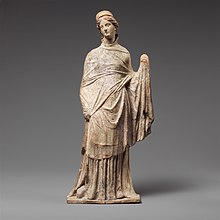Greek terracotta figurine or Tanagra figurine, 2nd century BC; height: 29.2 cm Terracotta statuette of a draped woman MET DP117152.jpg