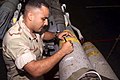 US Navy 011104-M-4912C-002 Service members sign weapons before deployment.jpg