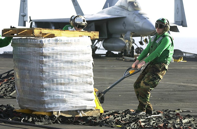 File:US Navy 030926-N-9319H-005 Storekeeper Seaman Jason Austin from Fayetteville, Ark., pulls a pallet jack.jpg