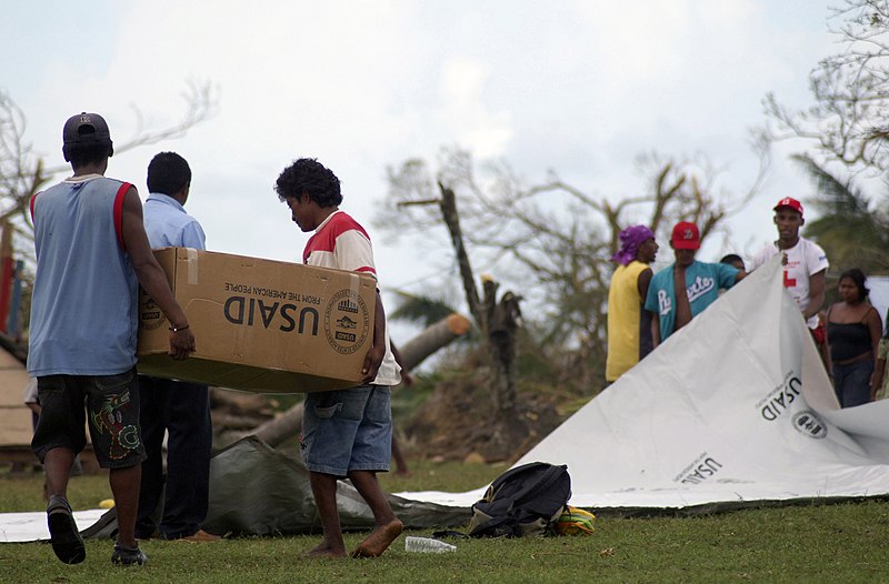 File:US Navy 070907-N-1810F-063 Nicaraguan citizens carry boxes of Meals Ready-to-Eat (MREs) to their homes after the food was delivered by Sailors attached to multi-purpose amphibious assault ship USS Wasp (LHD 1).jpg