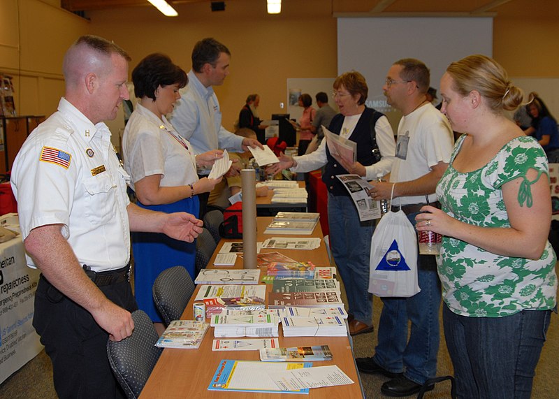 File:US Navy 090902-N-9860Y-001 Cliff Foley, a Navy Region Northwest Fire and Emergency Services fire inspector, discusses fire safety with an attendee to the Operation Prepare information fair.jpg