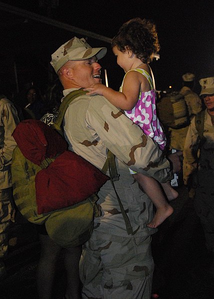 File:US Navy 100402-N-7084M-349 A Seabee assigned to Naval Mobile Construction Battalion (NMCB) 74 is welcomed home by his daughter at Naval Construction Battalion Center, Gulfport.jpg