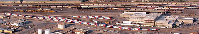 UTA's Warm Springs Service Center is at the right, with FrontRunner trains in the adjacent yard. View from Ensign Peak. UTA Warm Springs Service Center from Ensign Peak 9 Sep 2018.jpg