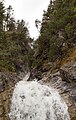 English: The Schronbach waterfall near the Sylvenstein reservoir. View to the upper part (above the street). Deutsch: Der Schronbach Wasserfall (nahe Sylvensteinspeicher). Blick auf die oberen Fallstufen (über der Straße).