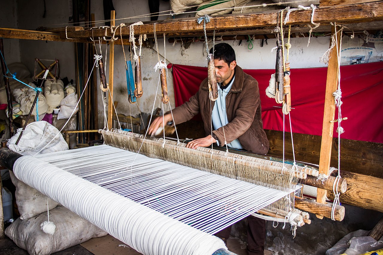 File:Weaving wool.jpg - Wikimedia Commons