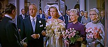 William Powell as J.D. Hanley prepares to marry Schatze, with Loco and Pola as bridesmaids William Powell, Lauren Bacall, Betty Grable and Marilyn Monroe in How to Marry a Millionaire trailer.jpg