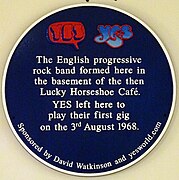 The Yes bubble logo on the blue plaque where Yes was formed in the basement of the then Lucky Horseshoe Café in 1968.