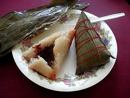 Zongzi both ready to eat (left) and still wrapped in a bamboo leaf (right)