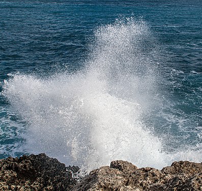 Sea spray blown up by the wind at the bay of Cala Figuera