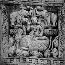 The Buddha's mother, Queen Maya, lustrated by elephants. Sanchi, Stupa 3 gateway, probably 1st century CE 059 Queen Maya lustrated by Elephants (33364982300).jpg