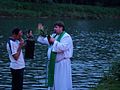 1 Priest Bless the San river. Midsummer evening at the Trepcza pier (Sanok).jpg