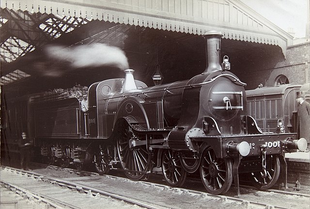 A Great Northern express engine on a train at an unidentified station probably in the 1880s