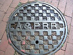 Extant manhole cover from the Anacostia and Potomac River Railroad Company A&PRR manhole cover.jpg