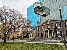 The Art Gallery of Ontario's five-storey main building situated behind The Grange, a two-storey Georgian-styled residence AGO Grange.jpg