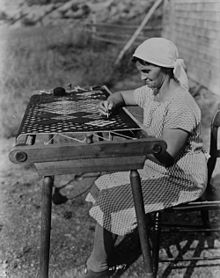 Acadian woman making a rug, 1938 Acadian lady making rug 1938.jpg