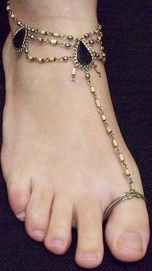 A toe ring with attached anklet
