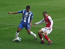 Clichy defending against Antonio Valencia in the 2007–08 season.