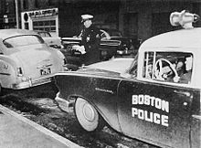 Investigating an abandoned stolen vehicle, 1958 Boston Police (1958).jpg