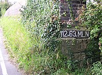 Location designator painted on a railway overline bridge, showing miles and chains Bridge miles and chains.jpg