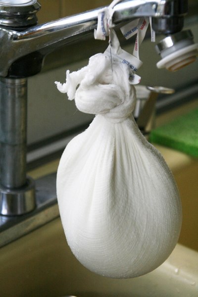 Traditional preparation of quark in a cheesecloth
