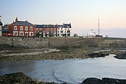 Cliff Terrace From the Breakwater With the lighthouse on the right and the war memorial standing in Redheugh Gardens left of centre.