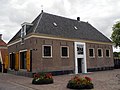 This is an image of rijksmonument number 8413 Former coachhouse of the drostenhuis (now entrance of the Drents Museum), at Brink 1, Assen.