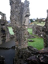 View of the remains of the ground-floor service rooms taken from the third-floor stairway of the living quarters, Coity Castle Coitycastledomesticrange.jpg
