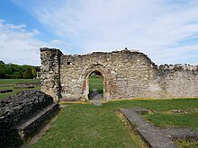 Abbey Wood is named after the ruined Lesnes Abbey, on high ground south of the town Doorway on the Western Side of the Courtyard at Lesnes Abbey.jpg