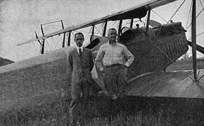 E. Dormoy (left) and pilot Lieut. J. A. Macready (right) in front of the 1st crop duster airplane (August 3, 1921)