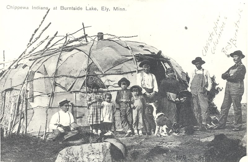 File:Family and visitors in front of wigwam at Burntside Lake – men at right are Christopher Columbus and Roy Burntside (Wm. Trygg) 1916 (5188070230).jpg