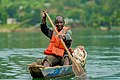 Fisherman riding a traditional boat.jpg