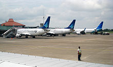 Comparison between Garuda's current and previous livery. Aircraft on right is in the current livery; the other two are in the airline's previous livery. (2010)