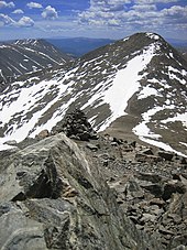 Grays Peak at 14,278 feet (4,352 m) is the highest point on the Continental Divide in North America Grays Peak, Colorado - 2007-06-17.jpg