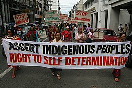 Lumads in Davao City marching for the right to self-determination as part of the human rights in Philippines in 2008. Indigenous march right to self-determination.jpg