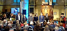 Students receiving honours from rector Luc Soete at UM's dies natalis Maastricht-39e Diesviering in de St. Janskerk (Universiteit Maastricht) (54 cropped).JPG