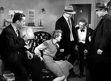 Bond (r.) with Humphrey Bogart, Mary Astor, Barton MacLane and Peter Lorre in The Maltese Falcon (1941) Maltese-Falcon-Tell-the-Truth-1941.jpg