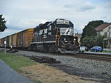 Norfolk Southern Railway freight train westbound on the Reading Line NS GP38-2 5662 WB Lyons PA.jpg
