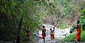 Kids, in this case novices, cooling down at Huai Kaeo waterfall, Chiang Mai, on a hot day