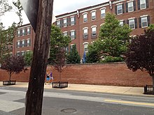 Brick wall separating Naval Square from Grays Ferry Avenue in Philadelphia NavalSquare.jpg