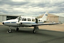 Early Navajo with two-bladed propellers and two-part entry door Piper PA-31-310 Navajo (VH-XGL) at Essendon Airport.jpg