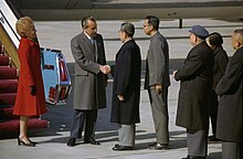 President Richard Nixon and Premier Chou En-Lai Shake Hands at the Nixons' Arrival in Peking, China.jpg