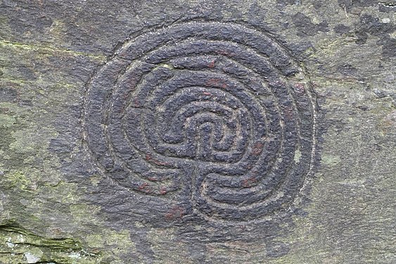 Carving of a maze into a rock face in Rocky Valley, Tintagel