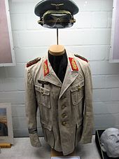 Rommel's Afrika Korps uniform. Note that the color, originally olive, is faded to greenish khaki. Rommel's Africa uniform.jpg