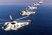 Helicopter Anti-Submarine Squadron HS-12 "Wyverns" flying SH-3H Sea Kings in formation, 1985. Military helicopters are a significant part of the helicopter market SH3H HS15 CVW15 1995.JPEG