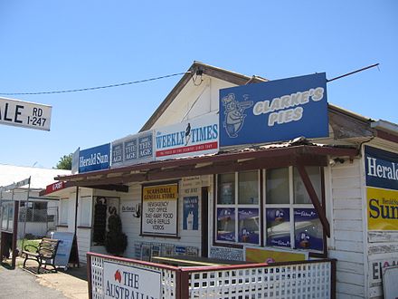 A general store in Scarsdale, Victoria, Australia operates as a post-office, newsagent, petrol station, video hire, grocer and take-away food retailer