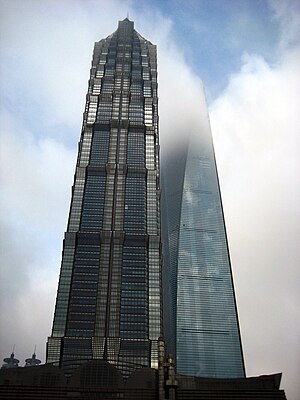 This is the pisture of Shanghai scyscrapers — Jin Mao Tower and Shanghai World Financial Center which disappears in the clouds.