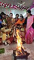 Sindur daan Hindu ritual as the groom is full blind ladies assisting her to complete rituals at Voice Of World Kolkata 18